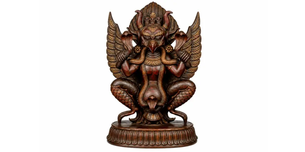 Garuda, With Snakes In His Hand And Horns On His Head 