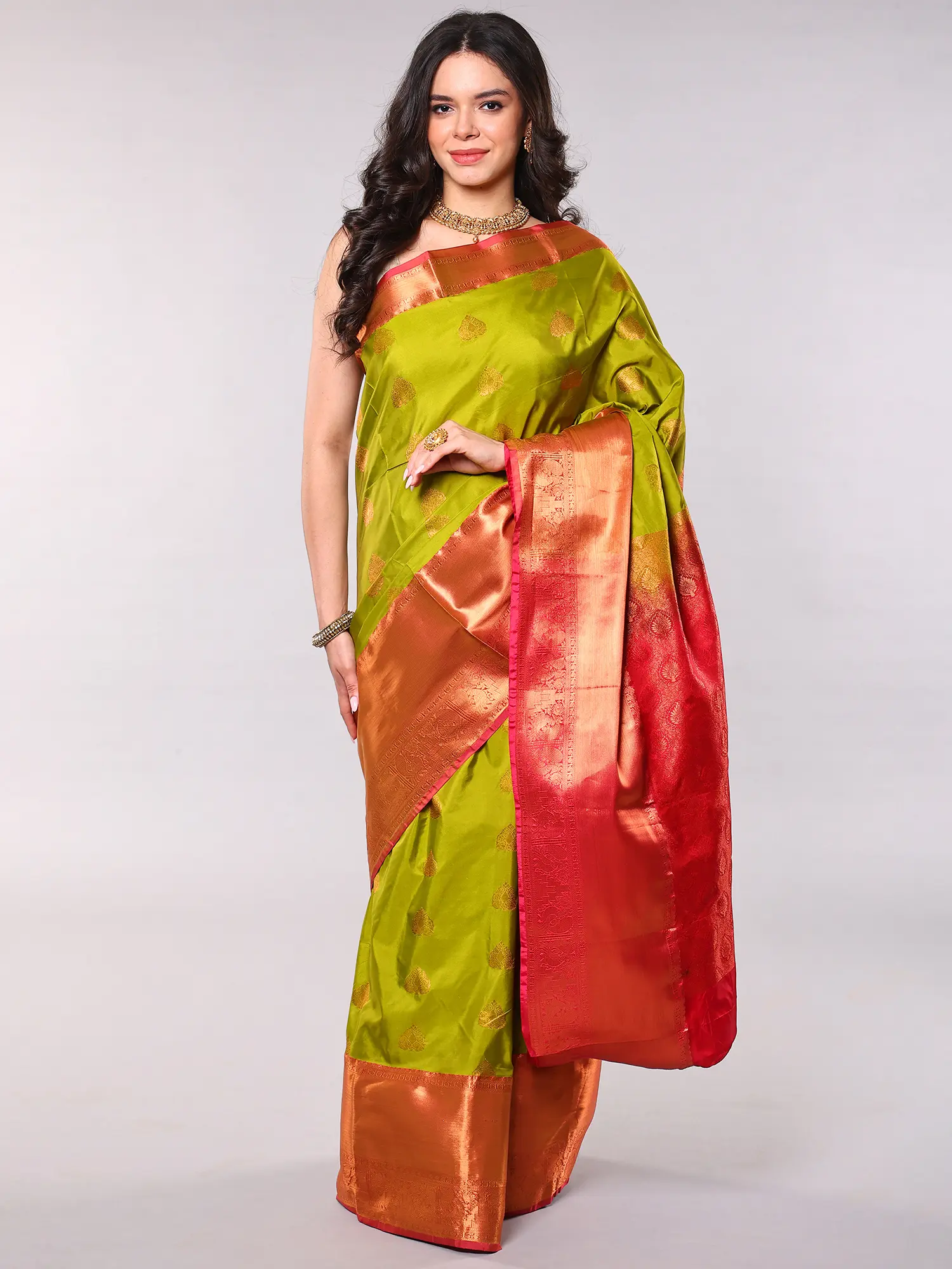 Green-Envy Saree with Woven Motifs in Copper Colored Thread and Contrast Peacocks Border from Bangalore