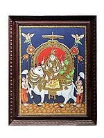 Lord Shiva with Parvati Seated on Nandi Tanjore Painting | Traditional Colors With 24K Gold | Teakwood Frame | Gold & Wood | Handmade | Made In India