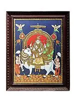Lord Shiva with Parvati Seated on Nandi Tanjore Painting | Traditional Colors With 24K Gold | Teakwood Frame | Gold & Wood | Handmade | Made In India