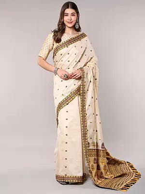 Woven Cream Saree Featuring Traditional Assamese Motifs and Patchwork Border