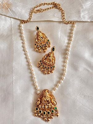Devi Lakshmi Studded Pearls and Green Stones Necklace with Earring Set