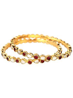 A Pair of Kundan Bracelets with Garnet-Red Beads