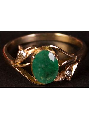 Faceted Emerald Oval Ring with Diamond