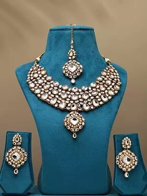 White Kundan Studded Necklace with Earrings and Mangtika Set