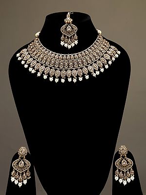 Golden and White Stone Studded Necklace Set with Earrings and Mangtika