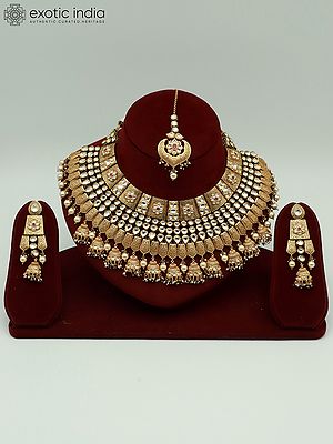 Attractive Kundan Stone Necklace Set In Brass With Mangtika And Hanging Beads Earrings For Bride