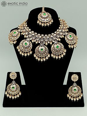 Stone Studded Brass Heavy Necklace Set With Earrings And Mangtika