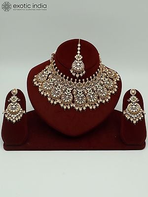Kundan Stone Necklace Set With Brass Carving, Pearls, Earrings And Mangtika