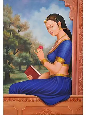 Young Indian Woman Dressed In Blue And Gold