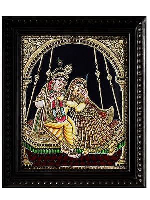 Hindu Deities Radha Krishna on Swing | Framed Tanjore Painting with 24 Karat Gold