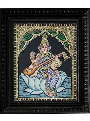 Devi Saraswati Seated on Lotus | Tanjore Painting with Frame | Traditional Colors with 24 Karat Gold
