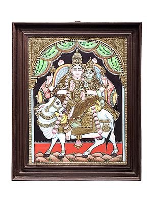 Lord Shiva with Parvati Seated on Nandi Tanjore Painting | Traditional Colors With 24K Gold | Teakwood Frame | Gold & Wood | Handmade | Made In India