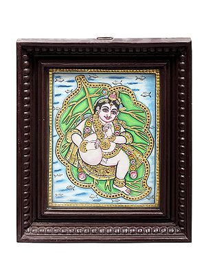 Vatapatra-Shayi Krishna Tanjore Painting | Traditional Colors With 24K Gold | Teakwood Frame | Gold & Wood | Handmade | Made In India