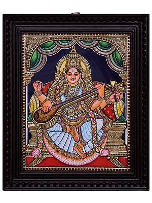 Goddess Saraswati Seated on Pedestal Tanjore Painting l Traditional Colors with 24 Karat Gold  l With Frame