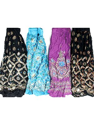 Lot of Four Skirts from Nepal with Painted Motifs and Sequins
