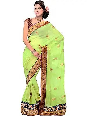 Foliage-Green Designer Wedding Sari with Metallic Thread Embroidered Booties and Patch Border