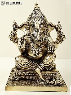 9" Lord Ganesha Seated on Pedestal and Eating Modak | Brass Bhagawan Ganesha | Brass Statue | Handmade | Made In India