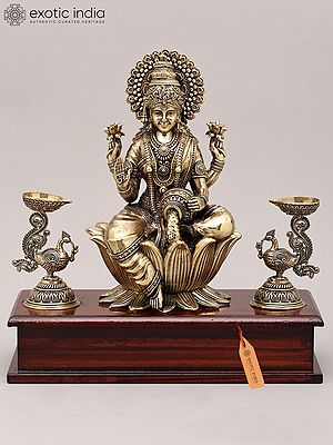 9" Superfine Four Armed Goddess Lakshmi with Peacock Lamp and Wood Base | Brass Idol