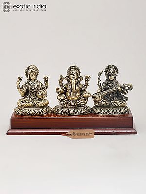 7" Superfine Trio of Goddess Lakshmi, Lord Ganesha and Goddess Saraswati with Wood Base | Brass Idol
