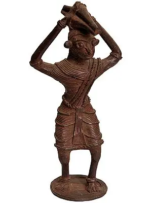 Tribal Man Carrying a Bundle of Firewood