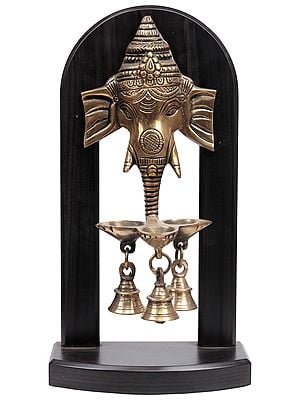 Lord Ganesha on Wooden Stand with Lamps and Bells