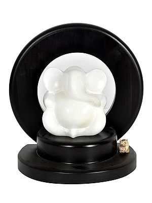 White Marble Ganesha Idol Seated on a Wooden Pedestal