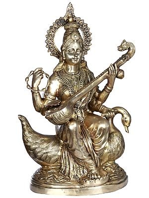 28" Seated Devi Sarasvati Upon A Riverine Pedestal In Brass | Handmade | Made In India