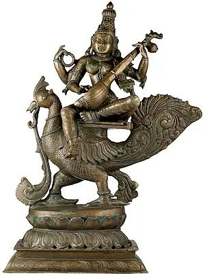 Saraswati Astride The Peacock, Strumming Her Veena