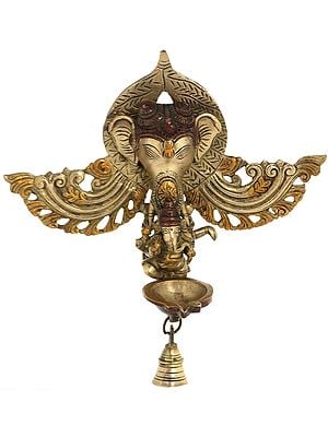 10" Ganesha Dancing Nestled in Trunk of Ganesha: Lamp and Temple Bell Wall-Hanging in Brass