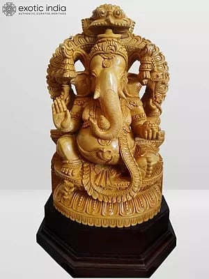 22" White Wood Ganesha Idol Sitting Under Kirtimukha Prabhavali