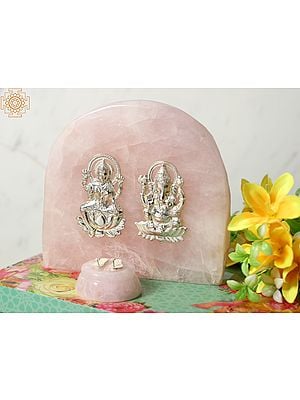 Silver Blessing Lakshmi Ganesha Idol on Rose Quartz Gemstone with Charan Paduka