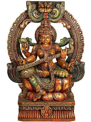 Goddess Saraswati Seated In Lalitasana on Lotus Throne with Kirtimukha Atop