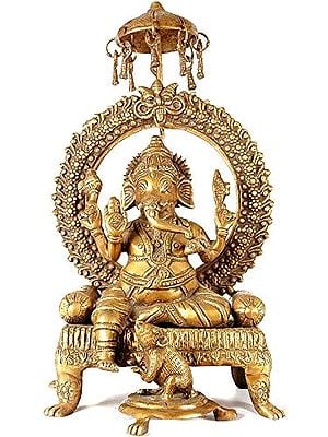 18" Enthroned Ganesha with Kirtimukha and Parasol Atop In Brass | Handmade | Made In India