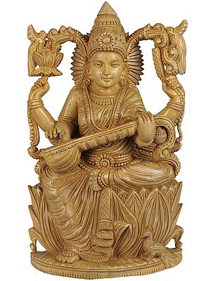 Four Armed Goddess Saraswati Seated on Lotus Wearing Sari