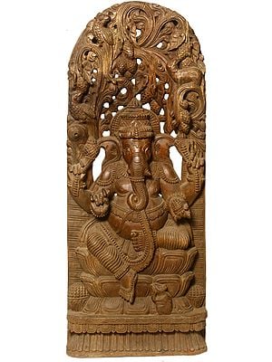 Four Armed Ganesha Seated in the Backdrop of Floral Aureole