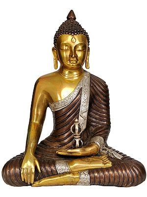 14" Brass Lord Buddha Idol with Dorje | Handmade | Made in IndiaIn the sacred iconography of Tibetan Buddhism, the representation of Lord Buddha alongside a Dorje carries profound spiritual significance. Lord Buddha, the enlightened sage, is venerated for