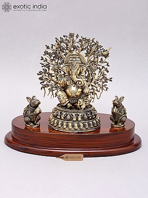 Lord Ganesha Brass Statue with Tree as Backdrop on Wooden Base