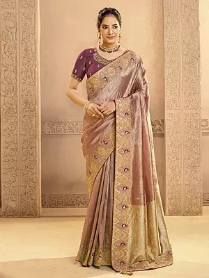 Elegant Metallic Zari Tissue Silk Saree Featuring Traditional Motifs And Detailed Cutdana Handwork For Special Occasions