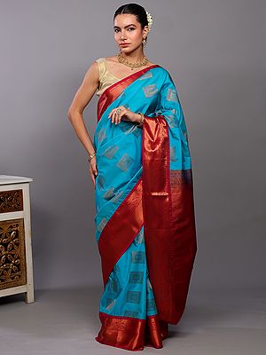 Scuba-Blue Kanjivaram Saree with Woven Peacocks Motifs in Copper Colored Thread and Contrast Border-Anchal from Bangalore