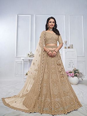 Soft Net Heavy Embroidered Bridal Lehenga Choli With Tassels And Matching Dupatta