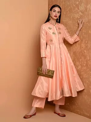 Peach Silk Asymmetrical Kurta Set With Unique Patch Work Detailing And Three Quarter Sleeves Paired With Straight Pants