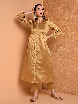 Women Elegant Beige Embroidered Flared Silk Kurta Set With Pants For Party Wear And Festive Occasions