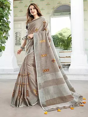 Linen Saree With Soft Breathable Drape Subtle Texture And Delicate Floral Embroidered Motifs For Everyday Festive Wear