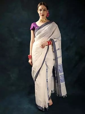 Plain Handloom Saree from Assam with Woven Jungle Scene on Anchal