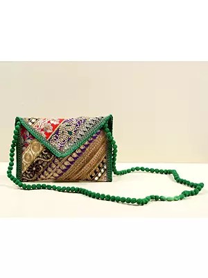 Patchwork Zari Sequin Embellished Handcrafted Clutch Bag with Threadwork Edges & Damru Dori From Jaipur