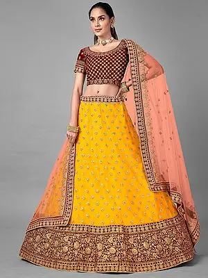 Mustard Soft Net Dori, Zarkan Lehenga with Maroon Velvet Jaalwork Choli