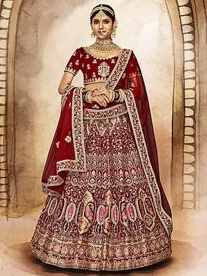 Burgundy Velvet Lehenga Choli All over Heavy Dori Embroidery with Stonework and Net Dupatta
