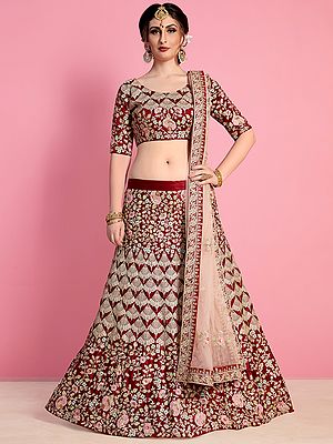 Oxblood-Red Velvet Silk Lehenga Choli With Zari Floral motif Dori-Sequin Work And Embroidered Dupatta