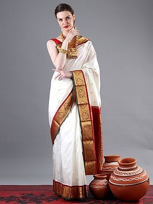 Pristine-White Kanjivaram Saree With Zari Motif And Traditional Green-Red Broad Border